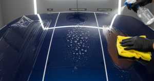 A blog banner image showing a comparison between wax and ppf.
