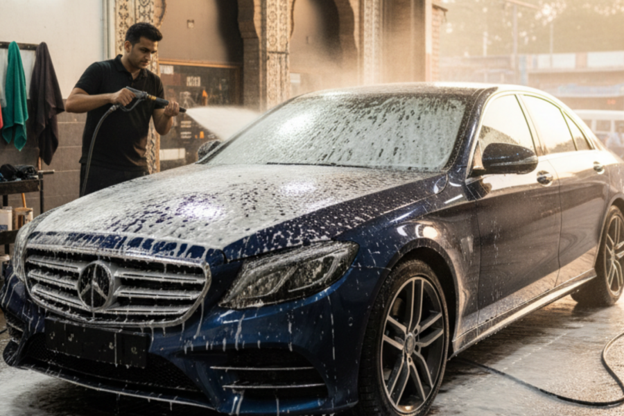 A blog banner image showing a car getting detailing services.