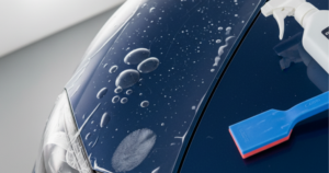 A blog banner image showing Monsoon Season Car Protection Process